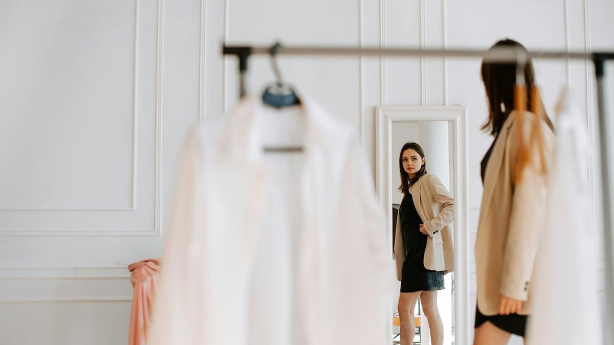 Evaluating an outfit in the mirror