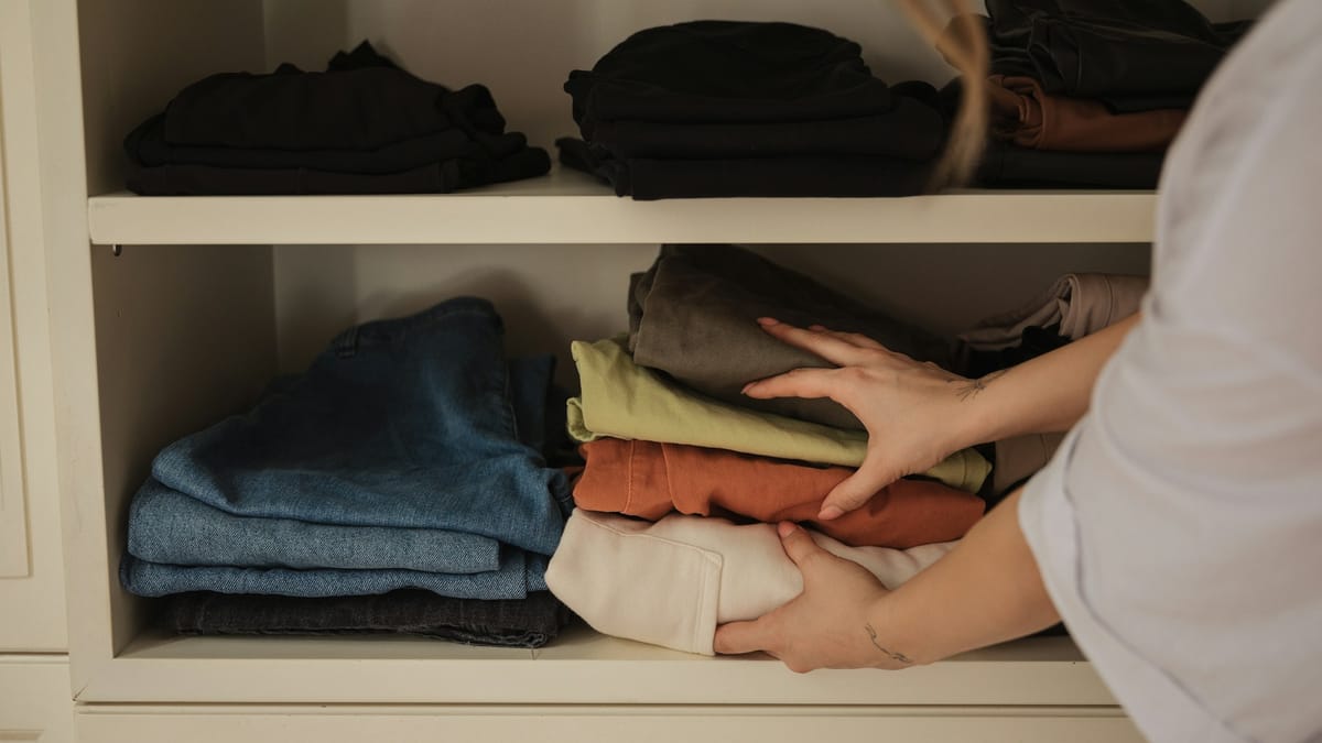 Organizing clothes into storage for the season ahead
